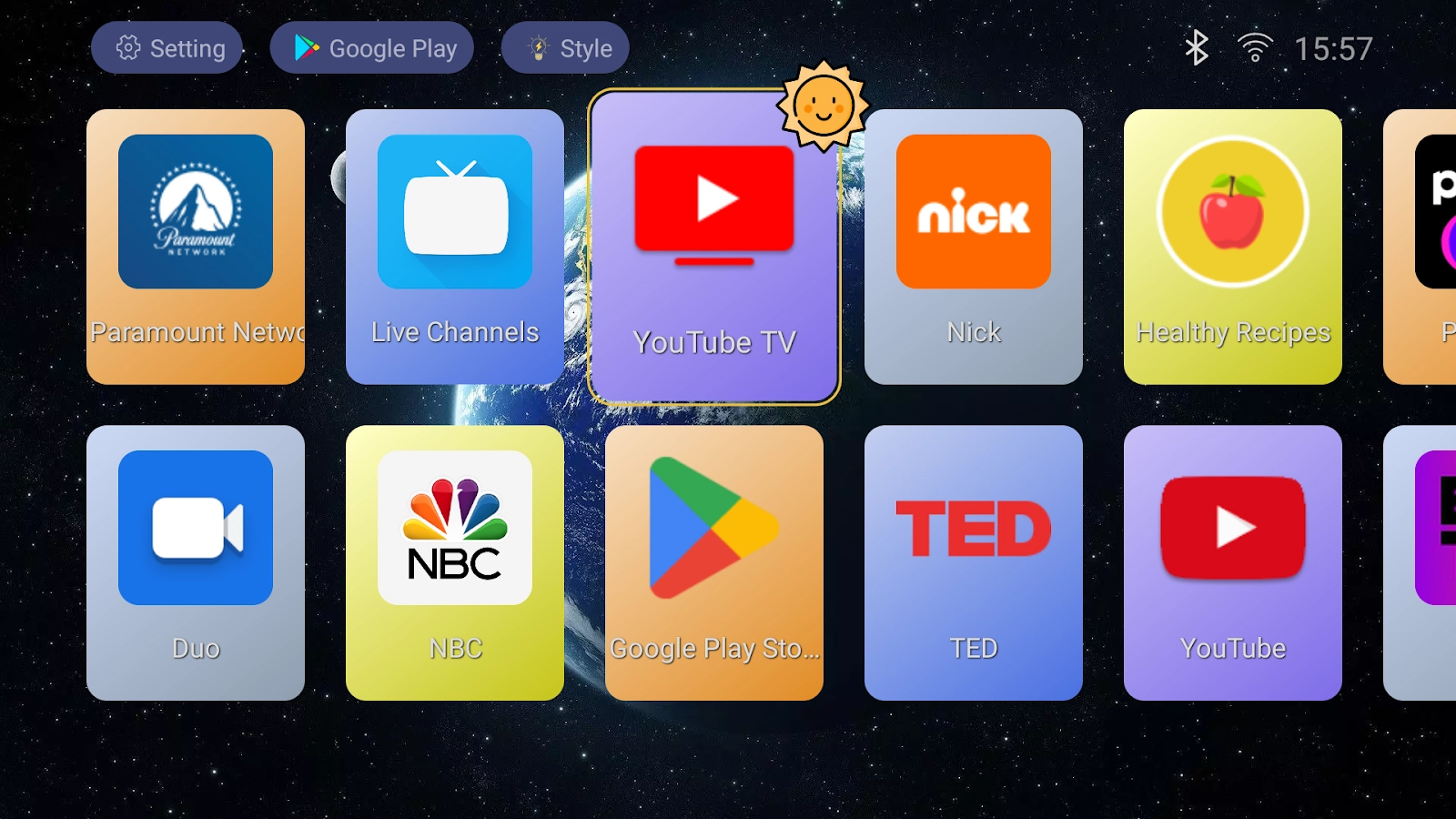 TV Launcher home screen with two rows of colorful app tiles and a highlighted selection